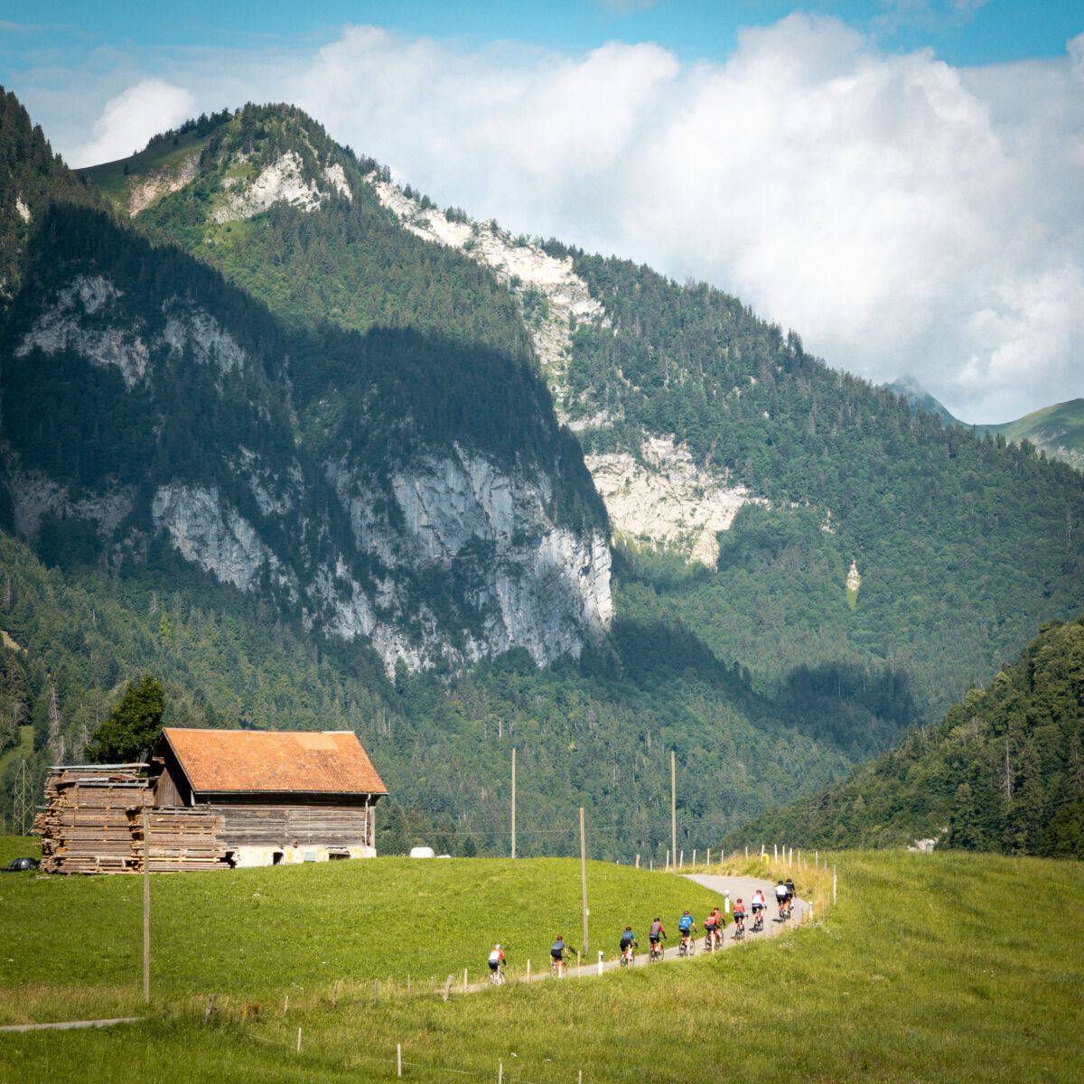 cliff background with cyclists